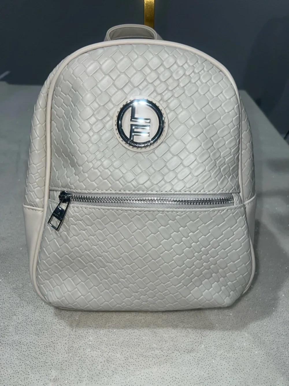 London Fog Stone colored Textured Backpack purse with Silver Logo NWT